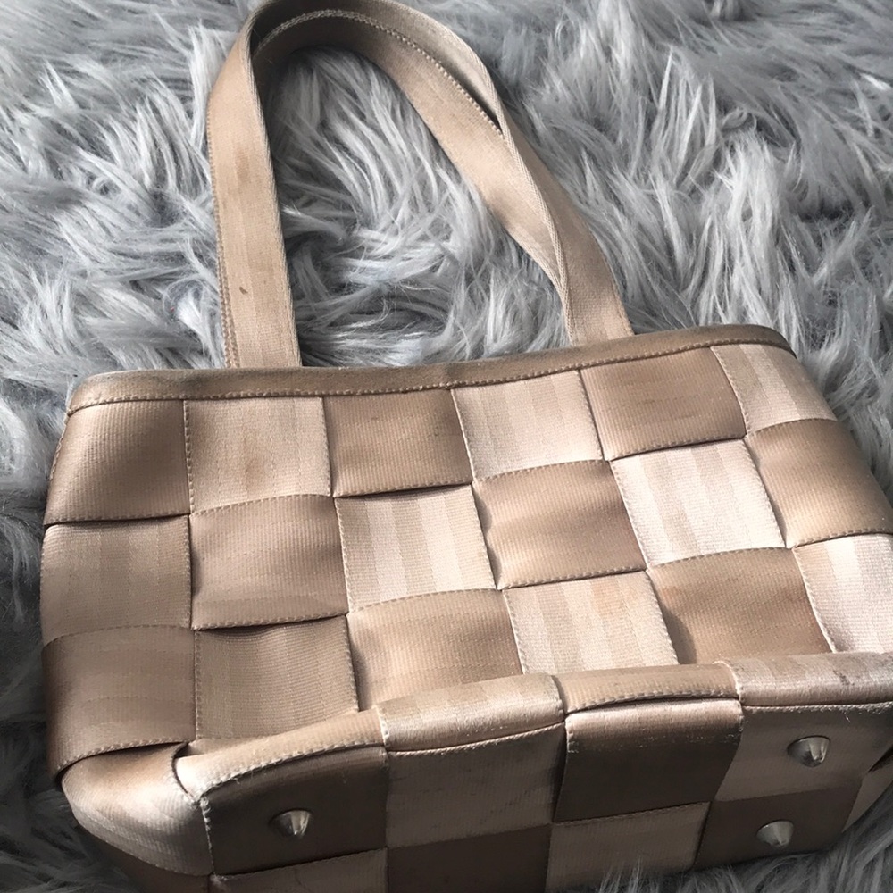 Gold durable seatbelt bag.